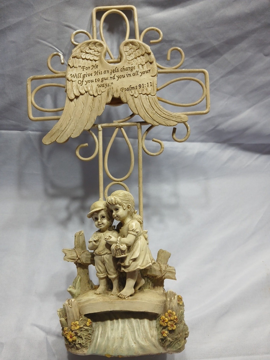Wire Cross With Angel Wings And Children At The Base